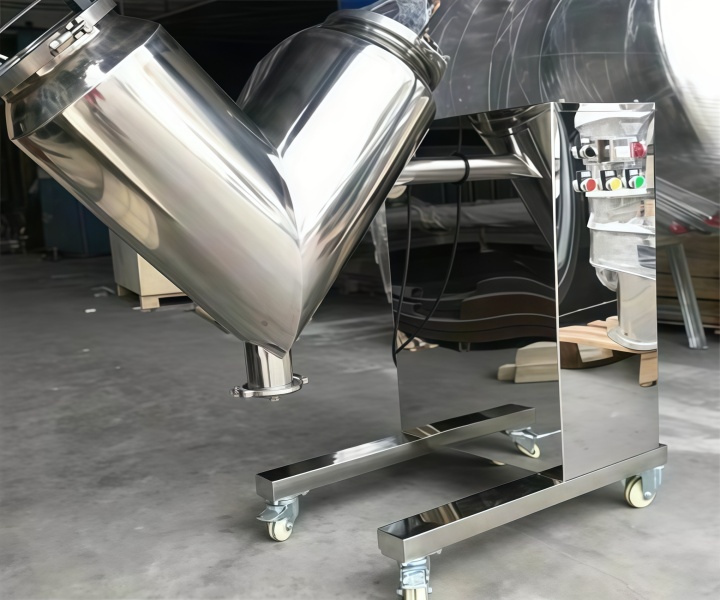 What is the function of a rotary drum feed mixer? 