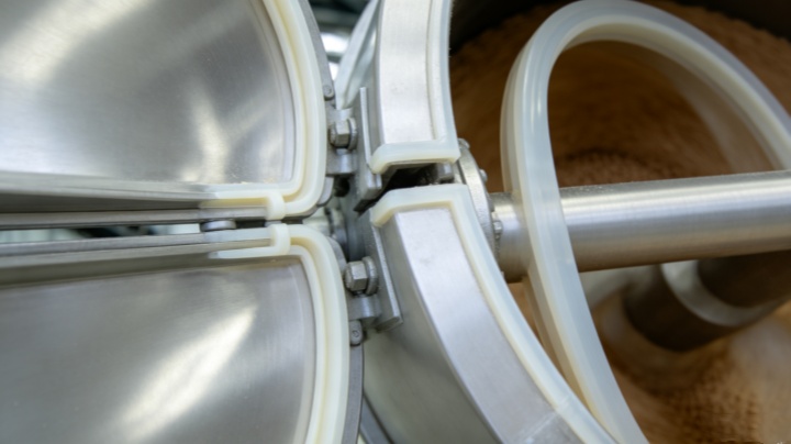 Close-up of core components inside a food-grade coffee powder mixer including stainless steel agitator, control panel, and premium motor